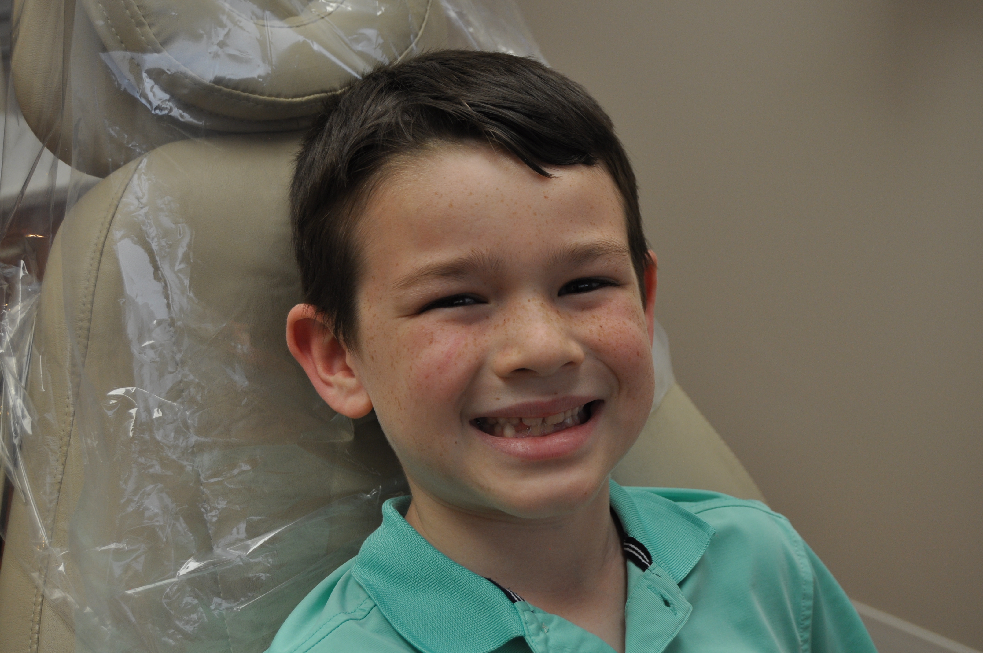 Boy Smiling in Dentist Chair